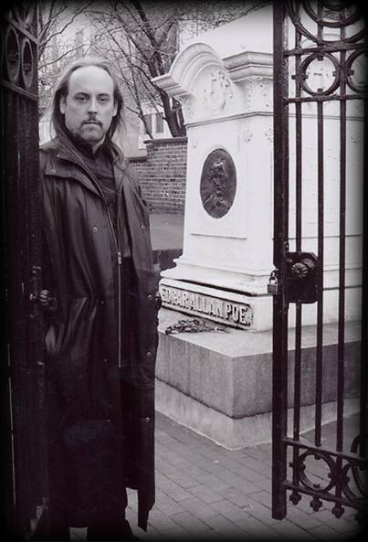Author Michael Vain standing at the gate to Poe's Tomb, Baltimore Md.