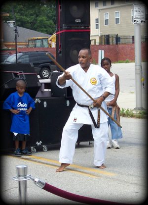 Kyoshi Mitchell gives a weapon form demonstration in Baltimore